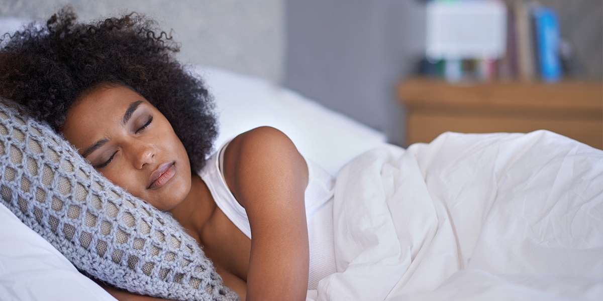 Woman sleeping peacefully in bed