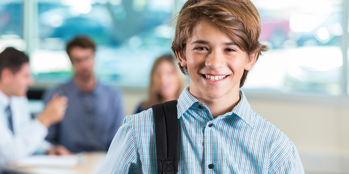 Boy in school smiling