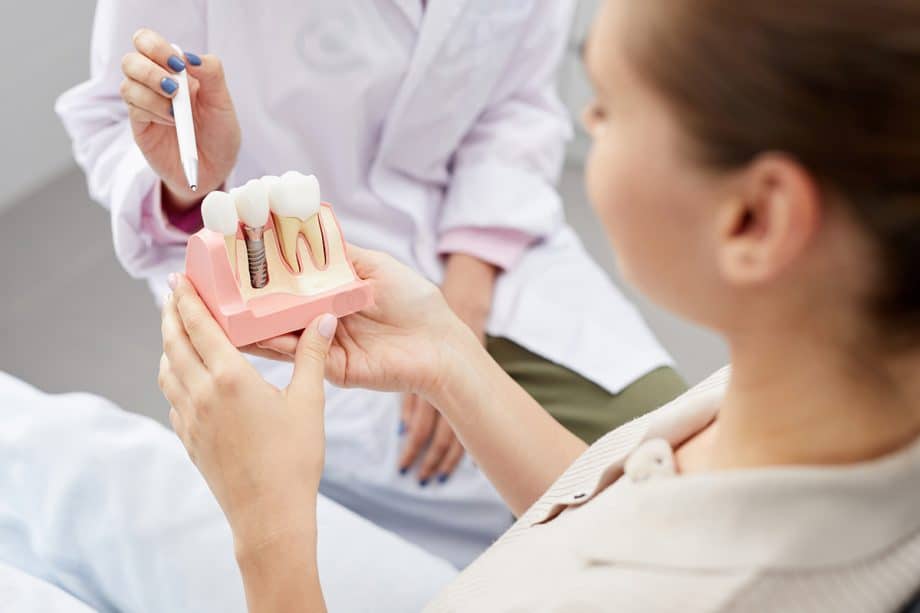 Woman looking at dental implant example